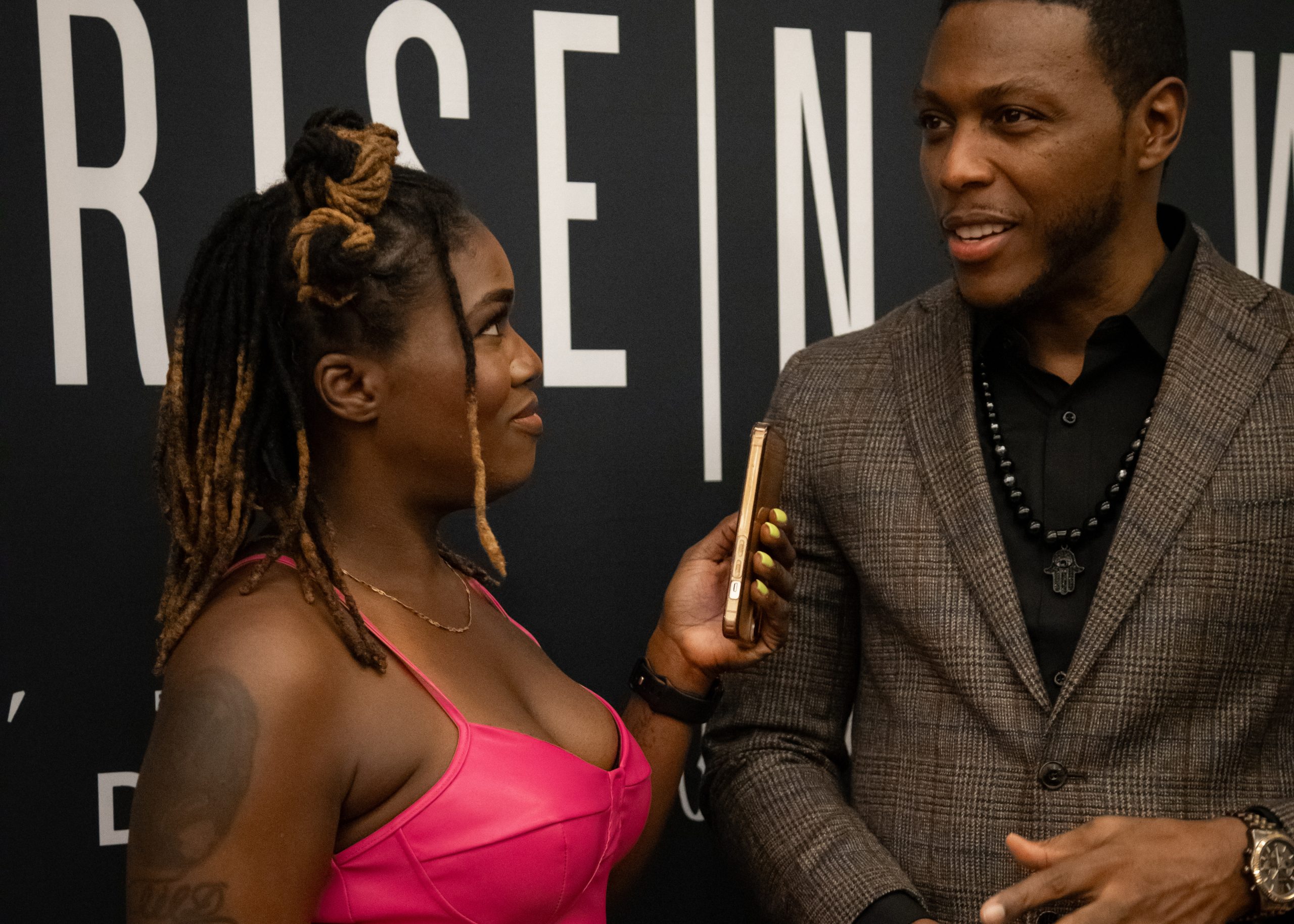 Dallas DJ Lil D interviews actor Jermel Howard (Power, The Purge) during boxer Franchón Crews-Dezurn's fashion week debut